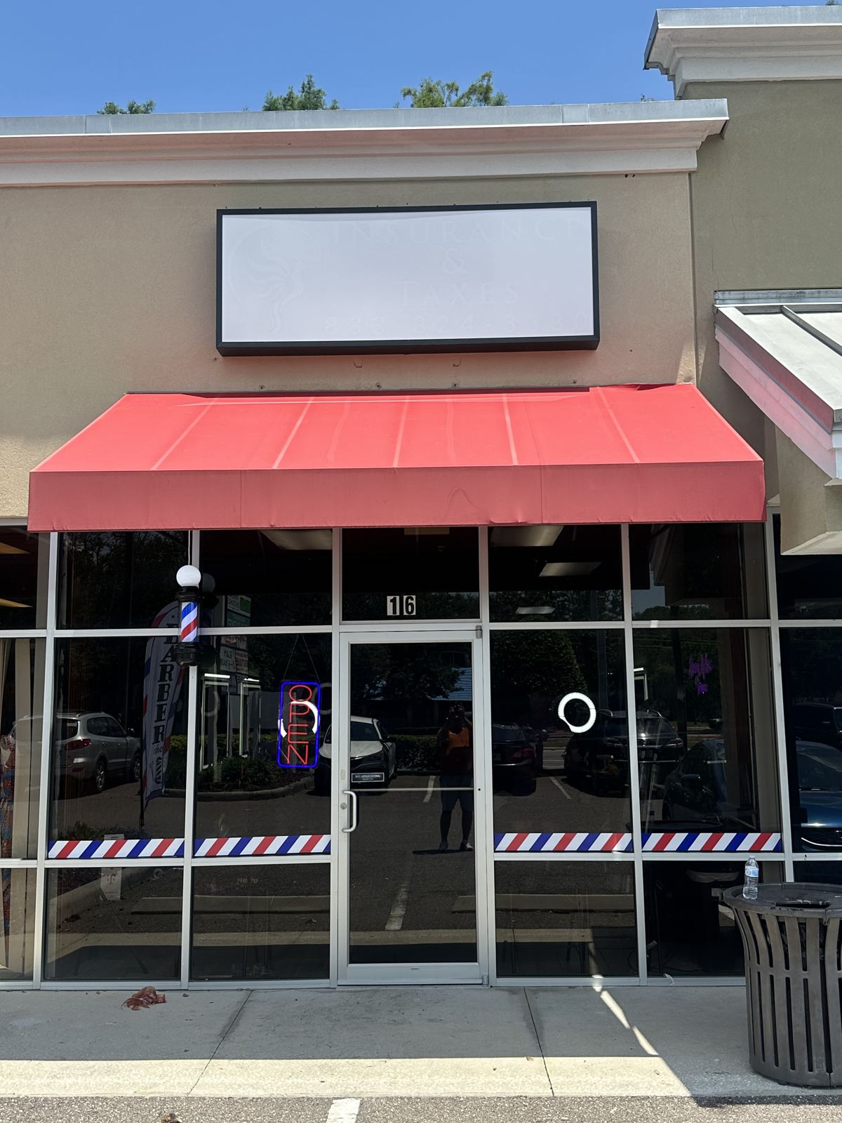 Caribe Barbershop before the sign