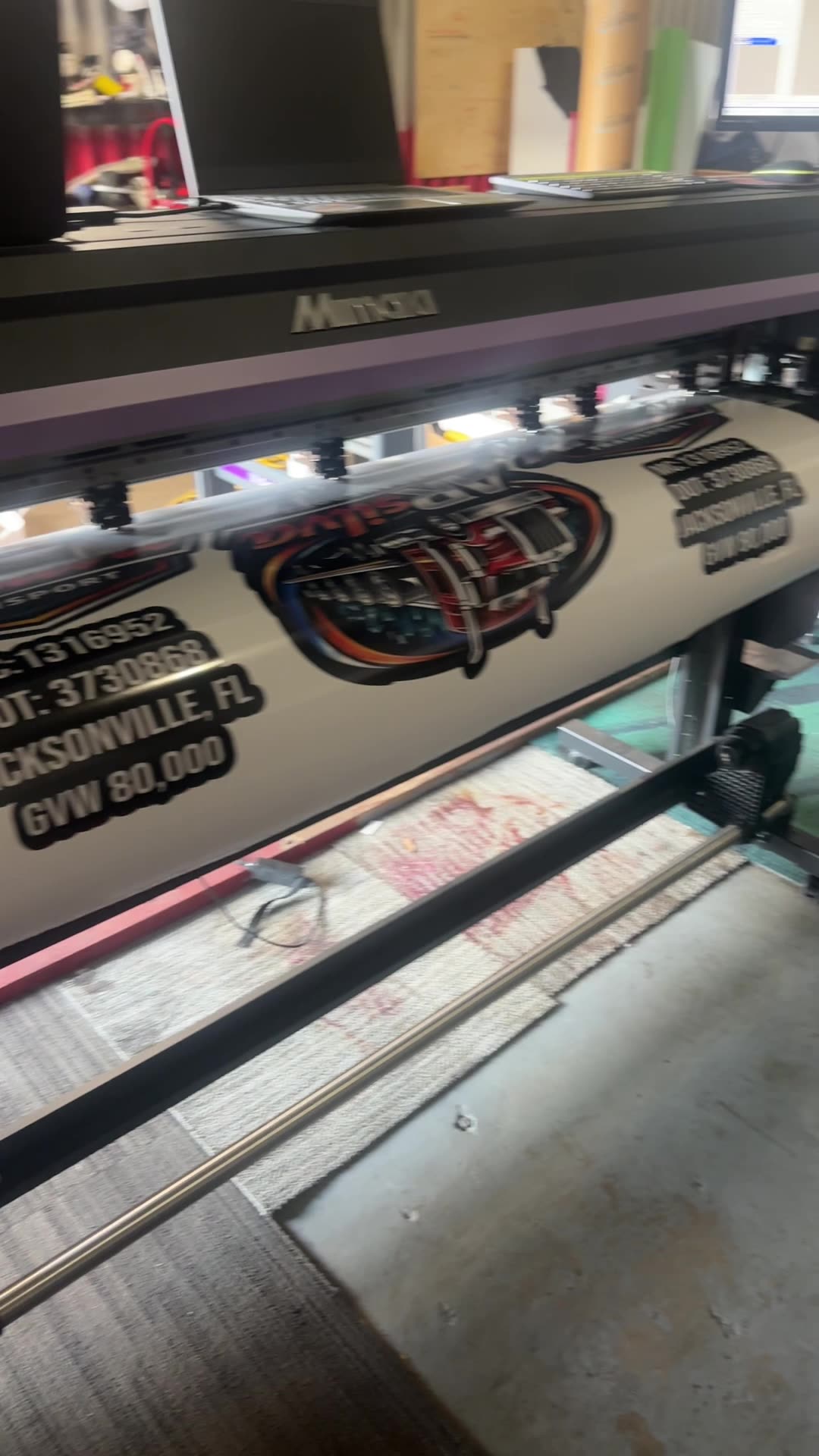 Mimaki plotter printing logo and DOT decals for a Jacksonville, FL truck